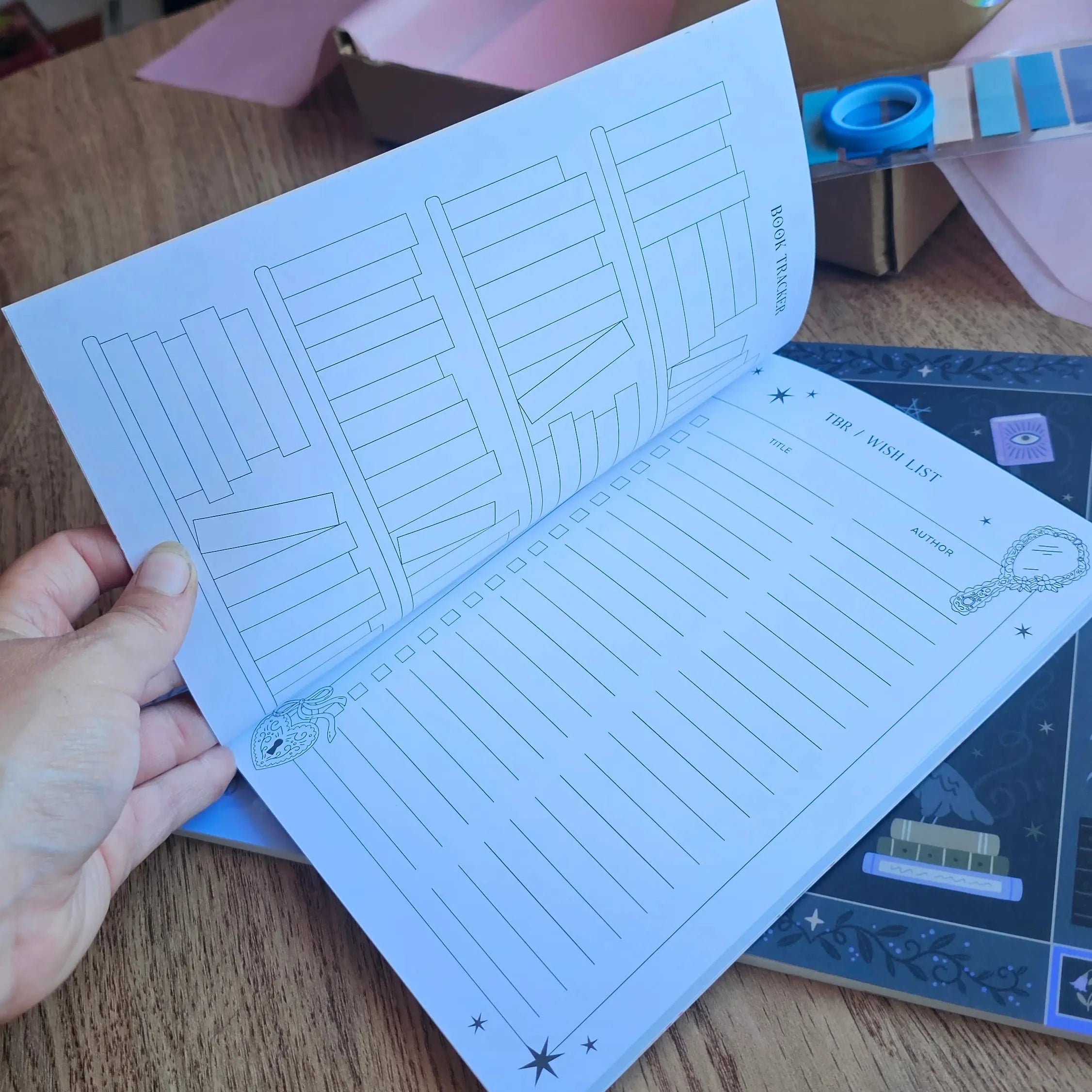 Inside pages of the Book Reviewer Bundle Reading Journal showing a book tracker spread and TBR wish list page with star rating sections