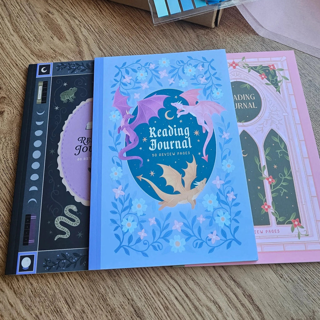Spread Those Pages Book Reviewer Bundle with Fantasy Dragons Reading Journal featuring pink dragon design, blind date book box, annotation tabs and washi tape