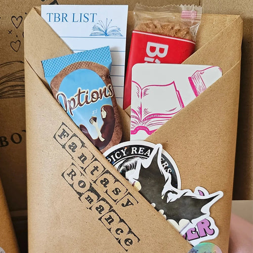 "Blind date with a book gift — fantasy romance wrap with Options hot chocolate, biscuit, bookish stickers and TBR list card"