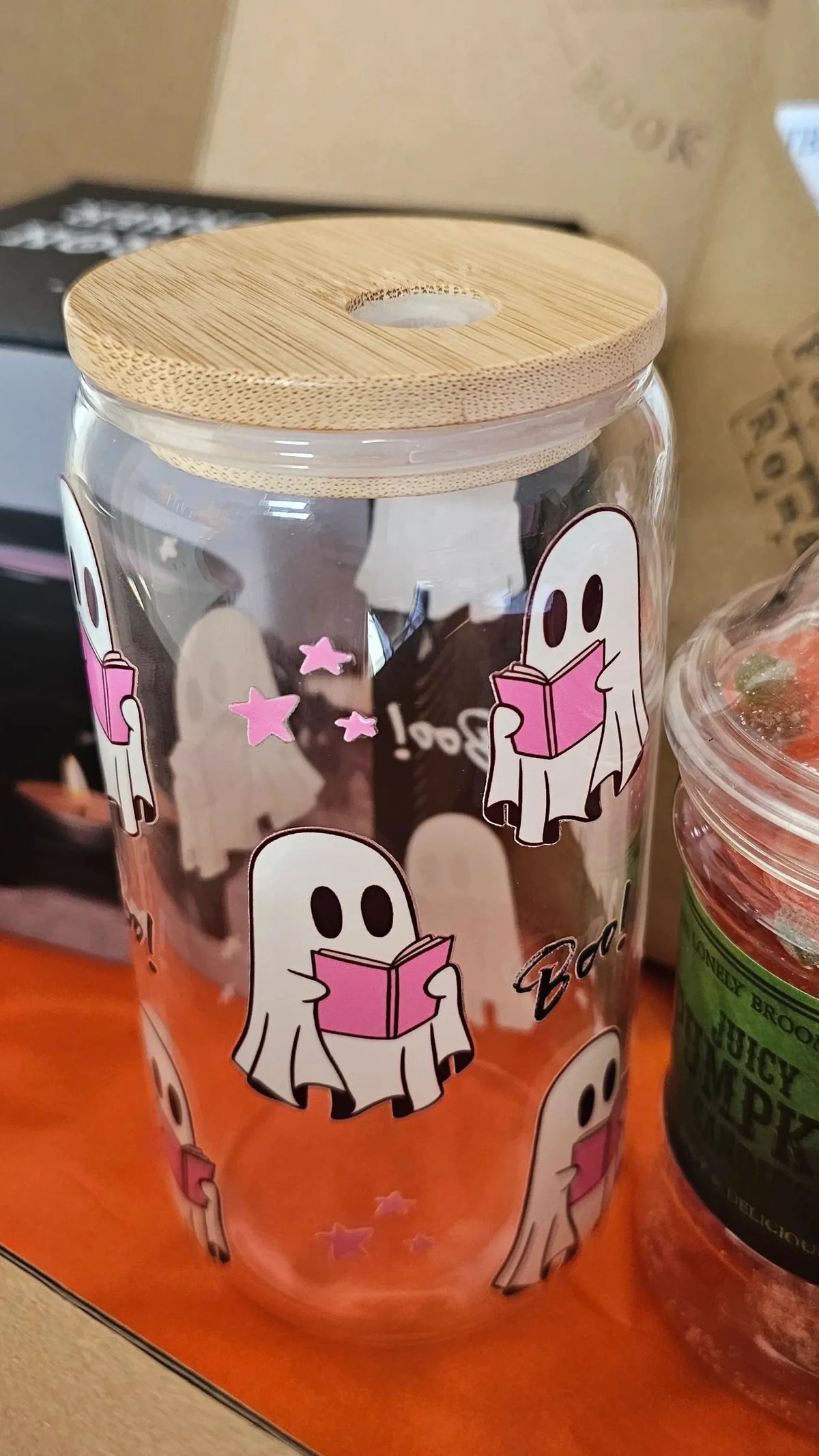 "Close-up of Ghosty Reader Halloween limited edition glass tumbler with reading ghost print"